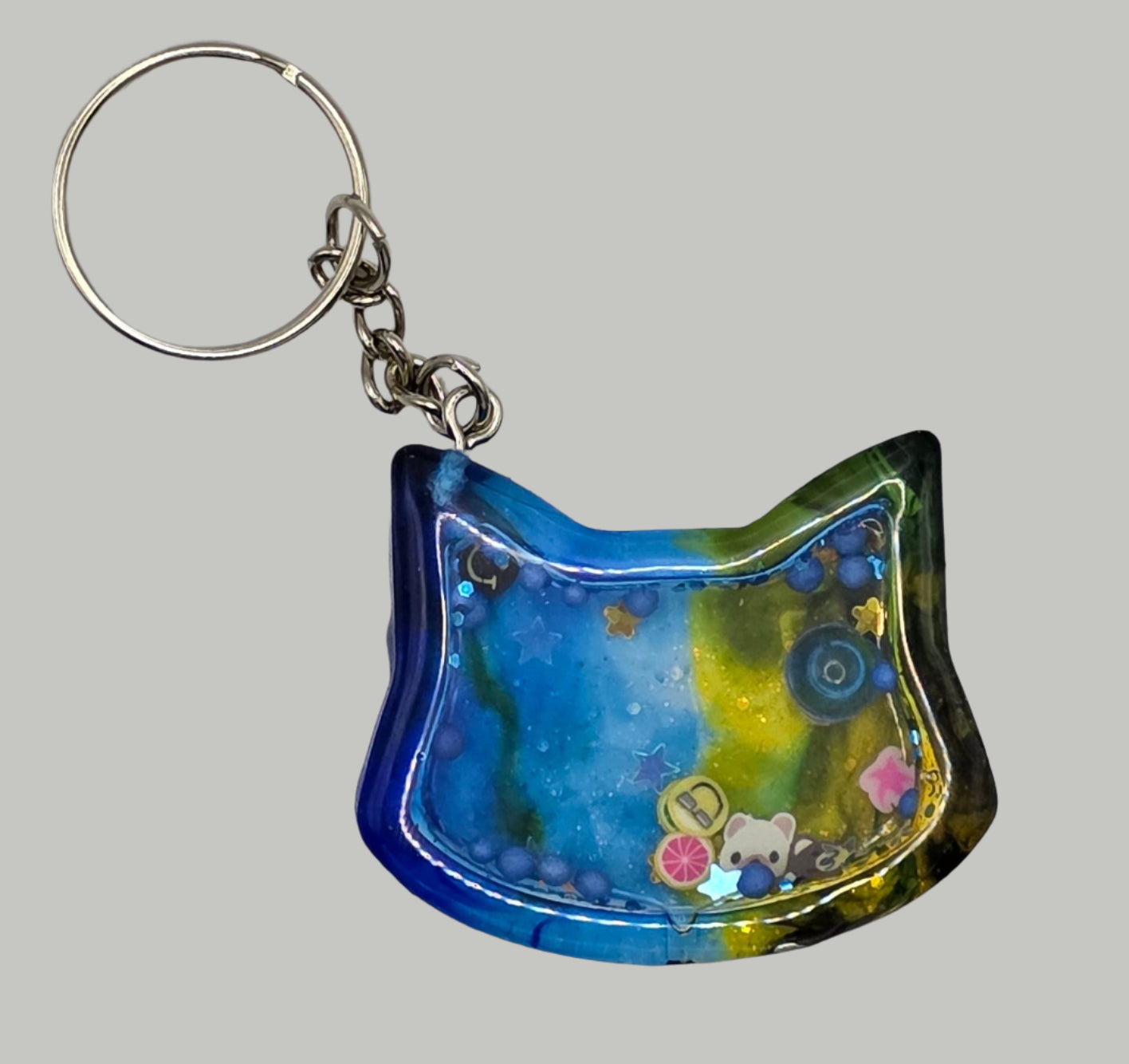 blue yellow cat head shaker keychain front
