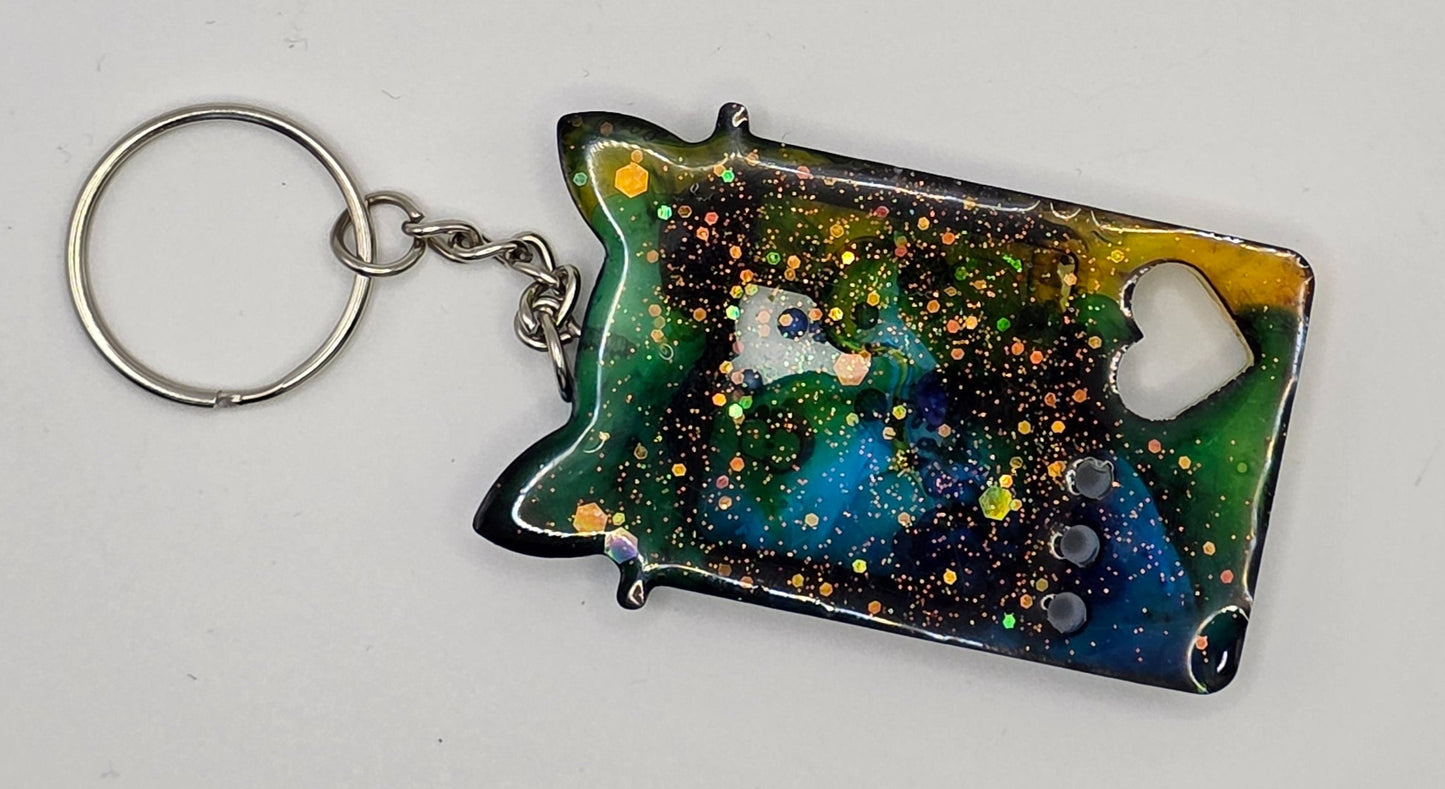 blue yellow claw game shaker keychain back