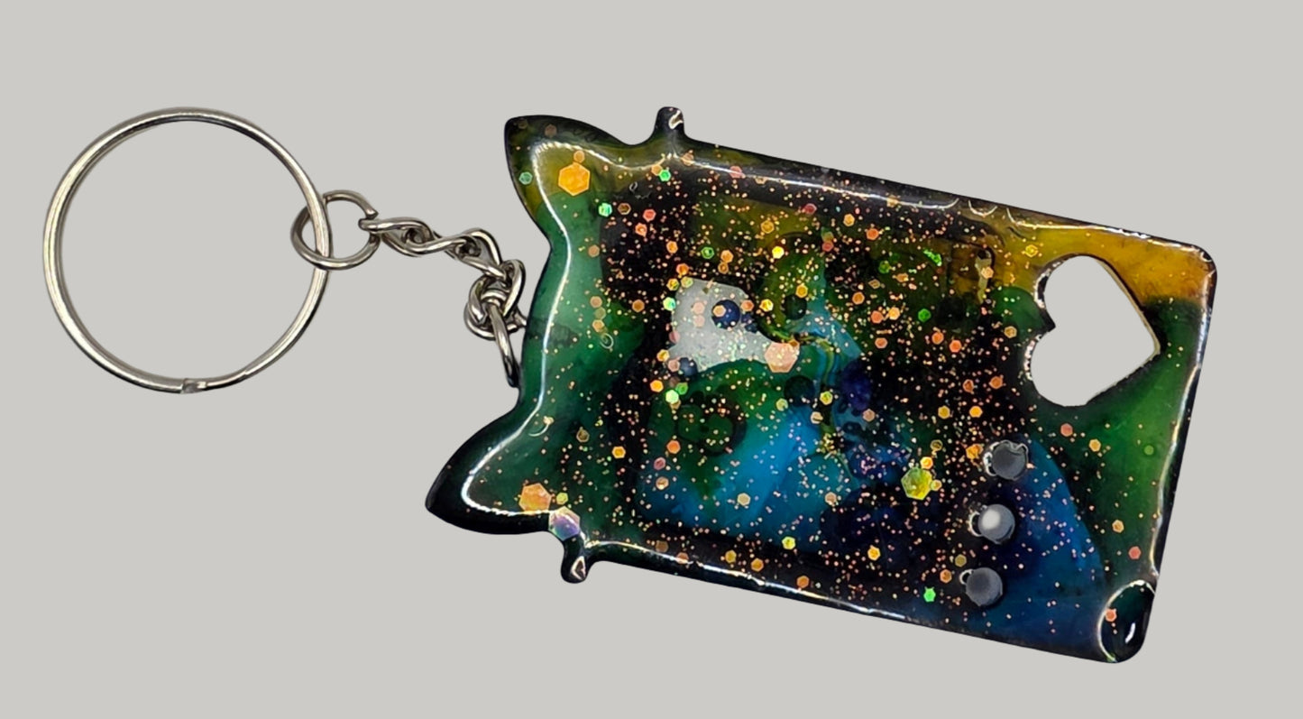 blue yellow claw game shaker keychain back