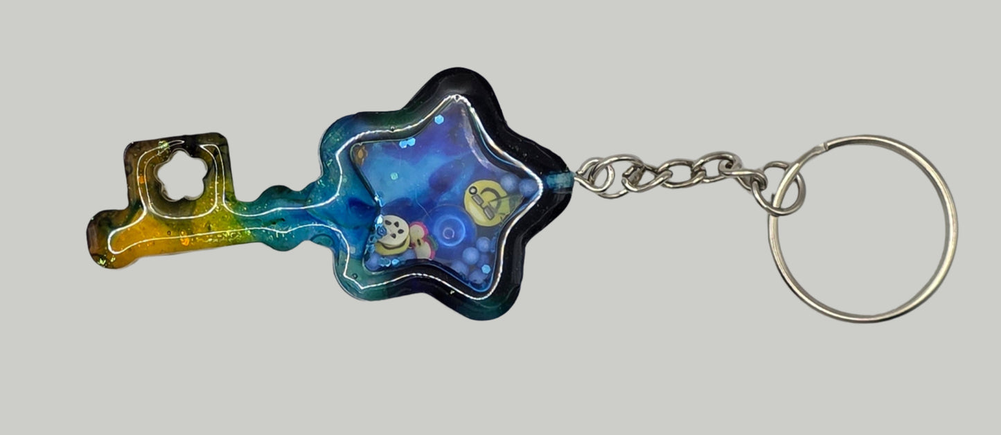 key shaker keychain yellow blue front
