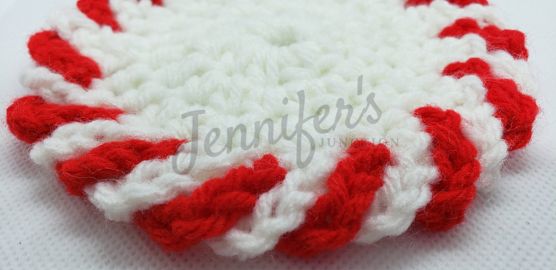 Crochet peppermint candy heart with red and white stripes on a white background, featuring 'Jennifer's' branding.