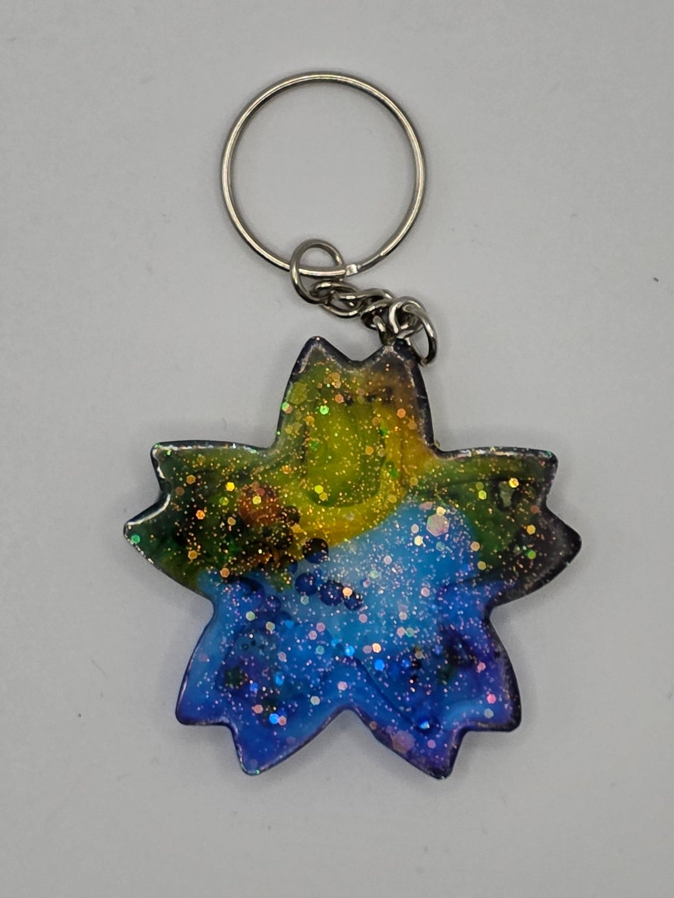 pointed star blue yellow shaker keychain back
